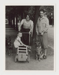 Ernst and Klara Brecher go for a walk in the park in Graz, circa 1934 with their son Heinz and their dogs.