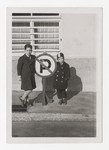 Heinz Brecher and his older cousin Robert Mayer stand next to a no parking sign in front of Heinz's apartment building in Graz.