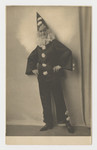Close-up portrait of Klara Taussig wearing a clown costume, 1920s.