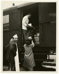 A woman unloads food supplies from a kitchen wagon in Bremen.