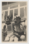 Two young boys share a swing in Graz, circa 1937.