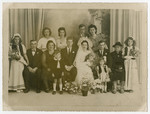 Portrait of the Bocahut family at a wedding celebration (sitting to the groom's right).