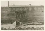 American POWs  stand outside a barrack in Stalag Luft 1.
