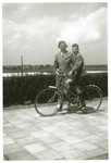 Max Heppner ridding a bicycle after the war. He is accompanied by [his mother].