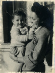 Anna Lenji poses with her baby daughter Judith after the war.