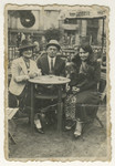 Hilda Jonisch (left) sits in a cafe with two friends.