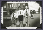 Misha Gruenbaum (left) and two friends walk down a street in prewar Prague.