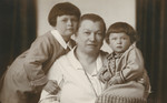Studio portrait of  Irka (left )and Hana (right) Lustig with their grandmother Karla Heller