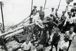 A group of teenagers stand on the deck of the Hatikvah while en route to Palestine.