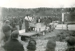 Rabbi Yehuda Lipot Meisels (right) presides over an exhumation and reburial service of the victims of the Pocking concentration camp.
