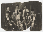 Group portrait of religious men clad in prayer shawls in Liptovsky Mikulas.