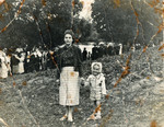 Musia and Leah Szklut stand in front of a river in Naliboki [possibly to do tashlich -- the ceremonial casting of sins performed on Rosh Hashana].