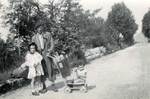 Leo Ermann poses on a rural road with his two daughters Mirjam and Suzanne.