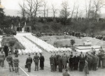 Survivors and American soldiers attend an exhumation and reburial ceremony of the victims of the Pocking concentration camp.