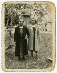 Charlotte and Regina Zarwanitzer, pose in a garden in prewar Bolechow.