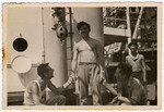 Four crew members entertain themselves en board [what is probably the Atzmaut, Pan Crescent].