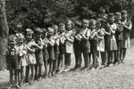 Jewish and non-Jewish kindergarten children in Hungary stand in line.