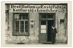 Samuel Kottlarzig (a great uncle of the donor) stands in front of his distillery for wine and vinegar in Ohlau, Schlesien, Germany.