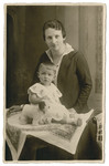 Studio portrait by Volpert of Sophie Oschinsky and her one-year-old daughter Ilse with her dog Molly.