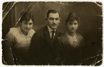 Three family members pose for a portrait. 

From left to right: Mariska-Miriam Herskovits, Emanuel Herskovits, and Regina (last name unknown).