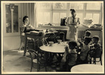 Jewish children in the Nos Petits kindergarten sit around a table to eat their lunch.