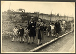 Teachers escort children from the Nos Petits Jewish kindergarten on an excursion.