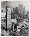 A bombed out home in the besieged capital of Poland - only the chimney and stove remain relatively intact.