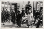 Polish civilians, soldiers, and medical personnel evacuate the wounded in besieged Warsaw.