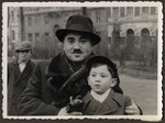Close-up portrait of Cantor Yehuda Mandel and his son Manny on a street in Budapest.