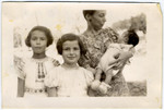 Portrait of a Jewish family in hiding.

Pictured left to right are Manuela and Jacqueline Mendels and their mother Ellen, holding their newborn brother Franklin.