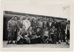 A group of Jewish men from the Bergen-Belsen displaced persons camp pose at the train station.