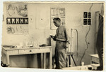 The instructor stands in his classroom in the ORT dental technician school in the Bergen-Belsen displaced persons camp.