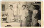 Three young men pose in the dental clinic of the Bergen-Belsen displaced persons camp.