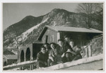 Young people [perhaps from the Eggenfelden displaced persons camp] pose by a mountain chalet.