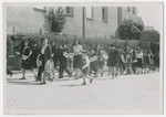 Jews from the Eggenfelden displaced persons camp participate in a commemorative march for the victims of a Nazi death march.