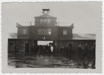 American soldiers enter the main gate to the Buchenwald concentration camp.
