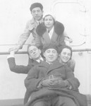 Lily Weinlaub and a group of her friends pose together on the deck of the SS Europa en route home to the United States.