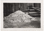 View of a pile of ashes of human remains outside the crematory of Buchenwald.