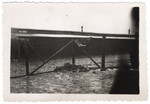 View of a barrack and fence in Buchenwald.

The original caption reads: "Barrack and enclosure.