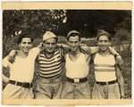 Group portrait of displaced persons in Kibbutz Mekor Baruch, a Poal Mizrachi fishing hachshara in Bacoli, Italy.