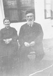 Close-up portrait of Moshe Aaron and Ottilia Schwarz outside their home.