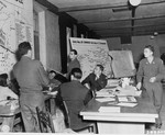 Wolfgang Otto, a former SS Sergeant, answers questions during the trial of 31 former camp personnel and prisoners from Buchenwald by indicating a spot on a map of the camp where prisoners were murdered.