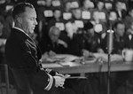 Lieutenant Jack Taylor testifies for the prosecution at the trial of 61 former camp personnel and prisoners from Mauthausen.