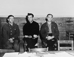 Three prisoners who await trial for murder and mistreatment of prisoners at Gusen, a sub-camp of Mauthausen, sit in on proceedings at the trial of former camp personnel and prisoners from Dora-Mittelbau.