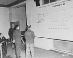 Hermann Helbig, an ethnic German from Poznan, Poland, identifies a diagram of a stable where Russian POWs were shot, during testimony he gave as a witness for the prosecution at the Buchenwald war crimes trial.