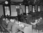 A witness presents evidence to the tribunal at the trial of 61 former camp personnel and prisoners from Mauthausen.