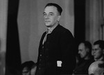 Johannes Grimm stands in his place in the defendants' dock at the trial of 61 former camp personnel and prisoners from Mauthausen.