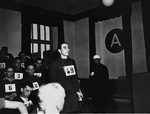 Former SS-Unterscharfuehrer Josef Riegler, a defendant at the trial of 61 former camp personnel and prisoners from Mauthausen, stands in his place in the defendants' dock.