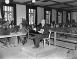 Dr. Klaus Karl Schilling, a physician who infected over one thousand prisoners with malaria in his experiments at the Dachau camp, defends himself at the trial of former camp personnel and prisoners from Dachau.