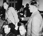 Former inmate Eugen Seybold points out Dr. Fritz Hintermayer as the man present at the mass execution of 95 high-ranking Russian officers held as prisoners of war, during the trial of former camp personnel and prisoners from Dachau.